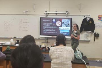 Medical student Libbie Milks speaks with high school students about medicine as part of the LIC.  