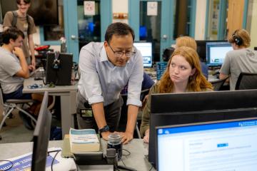 Atish Baidya WOUB editor in the studio at Ohio University