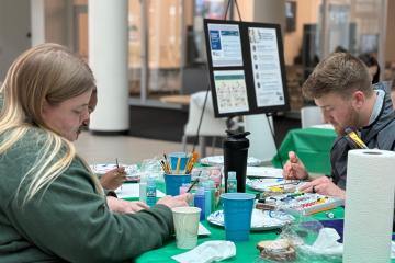 Students paint during art event to mark World Antimicrobial Resistance Awareness Week