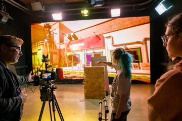 Media Arts and Studies Associate Professor Brian Plow and Media Arts Production students work the LED Wall.