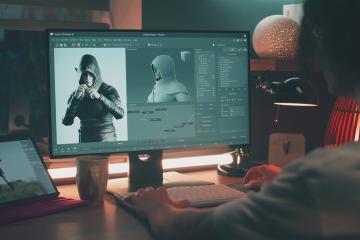 Game developer works at computer