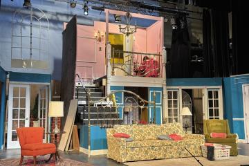 The set on stage for the play, "Leading Ladies"