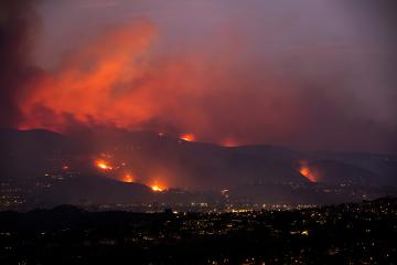 Fires burn on the dry hills surround the Los Angeles area.