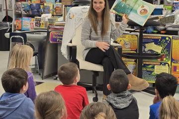 Ava Eldridge reads to students