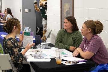 two women interview a third woman