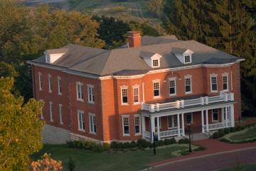 An aerial image of the Voinovich School building