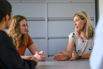 clinical professionals meeting in an office