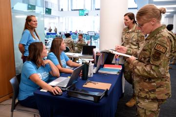 National Guard members and staff from the county health department prepare to assist patients