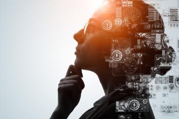 A graphic design  of a person thinking with computer images shown  around the person