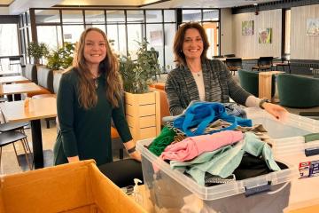volunteers sort clothing donations