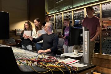Producer Joel Hamilton sits in his Brooklyn studio with five students