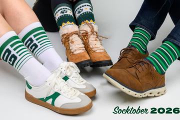 The image shows three people wearing different Socktober socks and the words "Socktober 2026"