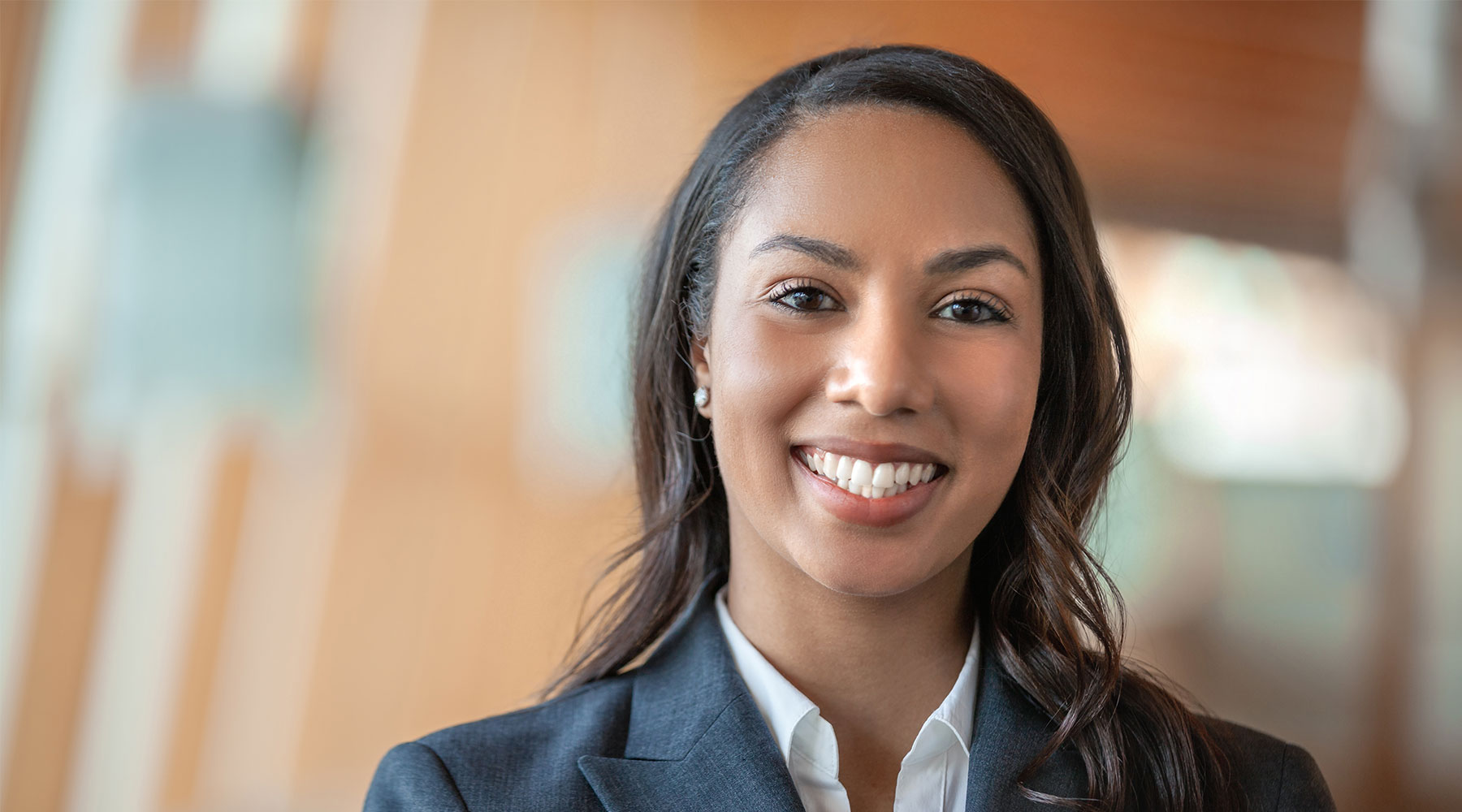 Smiling business woman in black shirt and jacket