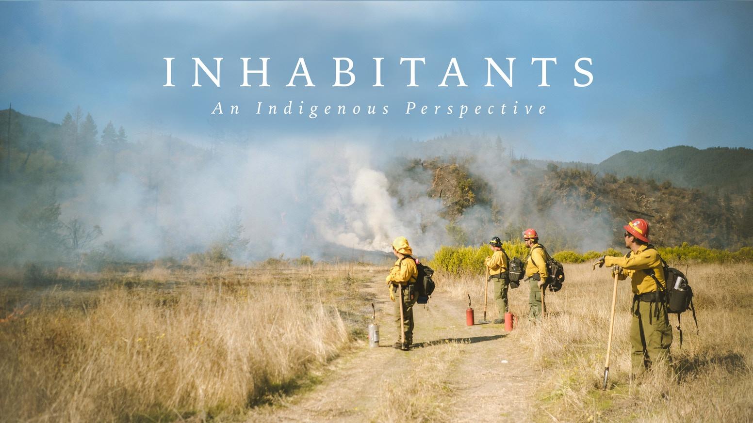 Firefighters putting out fire in desert